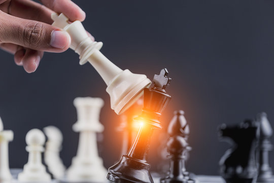 The King in battle chess game stand on chessboard Concept for company strategy,business victory or decision the path to success.