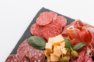 Cold smoked meat plate on a white background