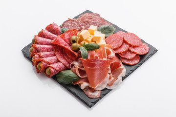 Cold smoked meat plate on a white background
