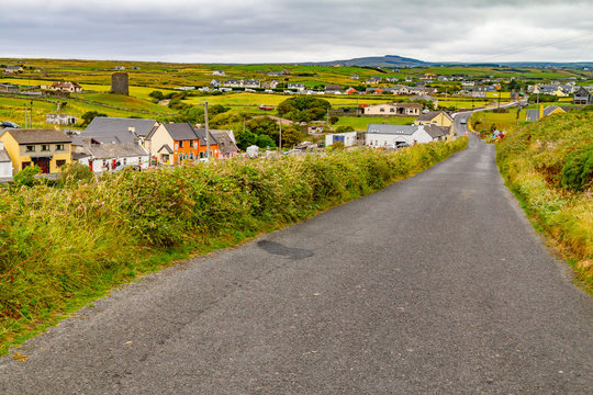 Doolin village with houses and farm fields