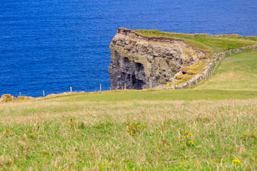 Fototapeta na wymiar Cliffs of Moher with farm field and ocean