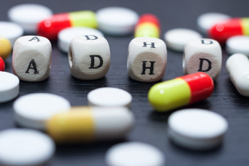 Mental Health Awareness concept for ADHD. Scrabble letters spelling ADHD.