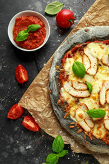 Stone Baked Black Pizza with chicken, tomato and mozzarella cheese