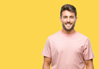 Obraz premium Young handsome man over isolated background with a happy and cool smile on face. Lucky person.