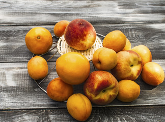 Fruits on a wooden background. Fresh fruit after harvest. Fruit for the production of juice, cocktail. Healthy lifestyle.
