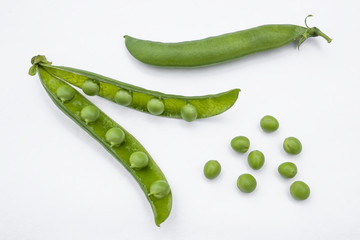 Fresh green peas pods isolated on white background
