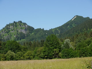 Mountain reflief behind field