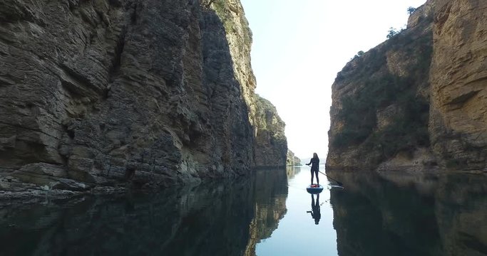 Woman Exploring Sulak Canyon Paddling on SUP Board, Dagestan, Russia.