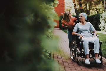 Woman with Mother. Cancer. Remission. Clinic.