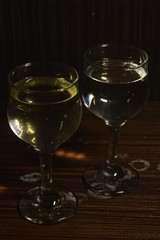 water and oil in a wine glass