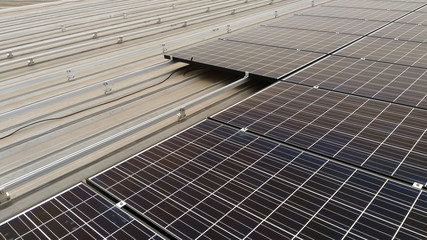 solar panel installation on roof © Eaknarin