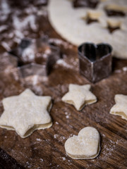 bakery Cookie dough with cutting mold on kitchen table.