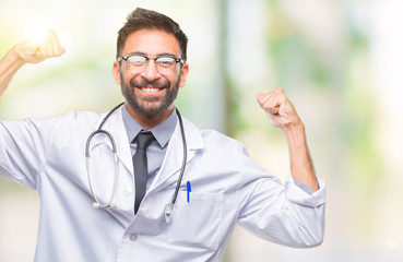 Adult hispanic doctor man over isolated background showing arms muscles smiling proud. Fitness concept.