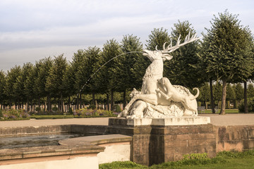 Schwetzingen Palace Garden. Deer group and tree alley. Schwetzingen, Baden Wuerttemberg, Germany, Europe