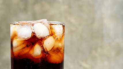 Iced aerated soft drink on a gray background.
