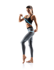 Young slim girl in sportswear isolated on white background. Concept of healthy life and natural...