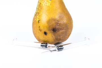 Close up Boring trace of a codling moth Cydia Pomonella, in a wormy pear. On white background. With...