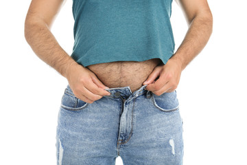 Overweight man in small pants on white background, closeup view