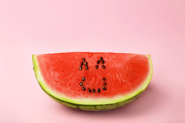 Watermelon with funny smiling face on color background