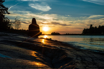 Fototapeta na wymiar Man meditating, yoga at sunset