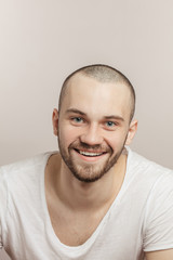 Obraz premium pleasant man is laughing at funny stories, isolated white background. closeup portrait, luck, fortune, bliss concept