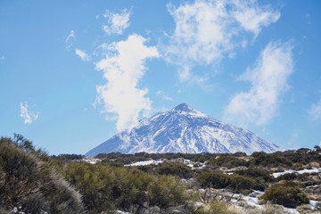 Fototapeta premium View of El Teide from the north side. Snowy and covered in clouds. Tenerife, Canary Islands
