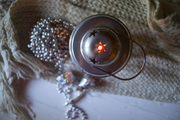 Burning candle and christmas decoration.