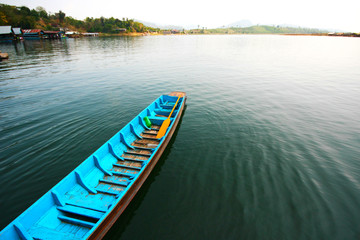 Blue tradition wooden boat on the river in Sangklaburi at Kanchanaburi Province, Thailand