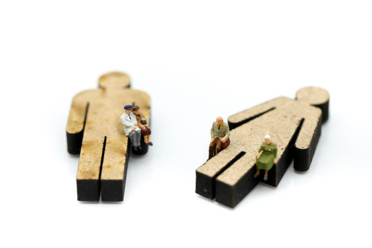 Miniature people : Old people with sigh of human using for concept of Older Peoples Day.