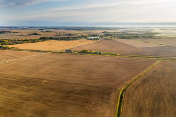 Brown agricultural fields in autumn time.