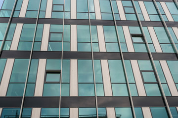 Glass office building facade close up.