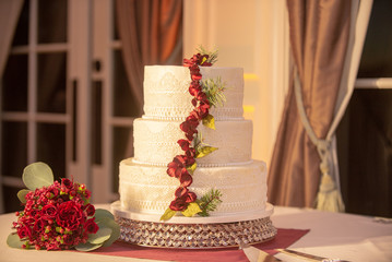 Three Tier Wedding Cake With Roses Strip Decor