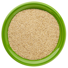 ivory teff grain in isolated bowl