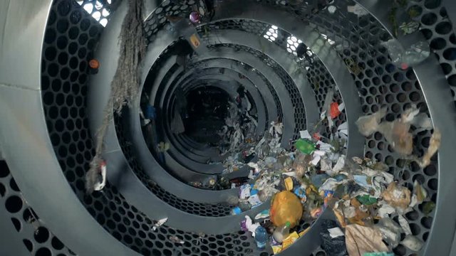 Mechanical sorting of trash, slow motion.