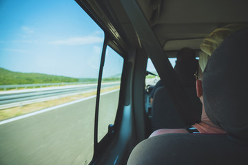 Tourists go to travel by minibus.