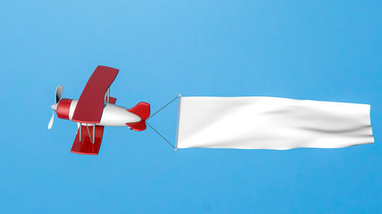 toy biplane in a blue sky with a white blank banner. 3D rendering © toomler
