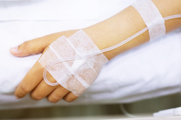 close up people focus on the hand of a patient sick on the bed in hospital ward. healthcare and medical