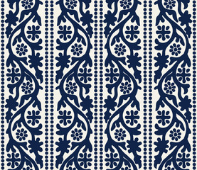 Woodblock printed indigo dye seamless ethnic floral pattern. Traditional oriental ornament of India Kashmir, flowers vertical wave motif and dots, navy blue on ecru background. Textile design.