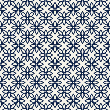 Woodblock printed indigo dye seamless ethnic all over floral pattern. Traditional oriental ornament of India Kashmir, geometric flowers motif, navy on blue ecru background. Textile design.