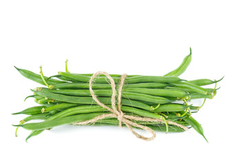 Green wax bean pods tied with a rope isolated on white background