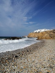 Fototapeta na wymiar Walking on the beach. Bright day on greek island!