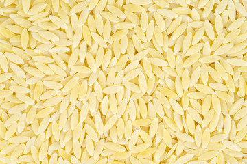 Pasta shaped like rice on white background