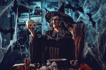 Fototapeta na wymiar Witch Tells Magic Words To Skull