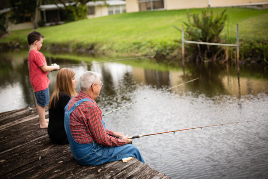 Woman on the Dock with a Fishing Pole Stock Photo - Image of happy, leggy:  42371484