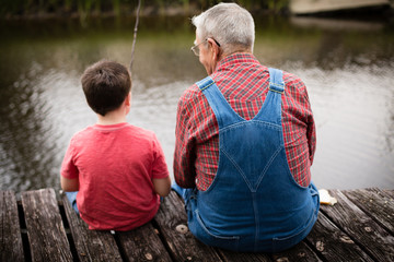 Happy Great Grandfather and Grandson Fishing Together - Powered by Adobe