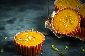 Homemade Mango Cupcakes Or muffins with cardamom and Pistachios, selective focus