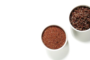 Cooked and Uncooked Raw Quinoa in a bowl isolated on white