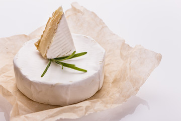 delicious creamy camembert cheese on a white background
