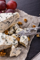 Fototapeta na wymiar delicious blue cheese on wooden rustic background