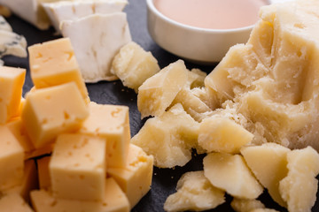 set of different cheeses on a wooden rustic background
